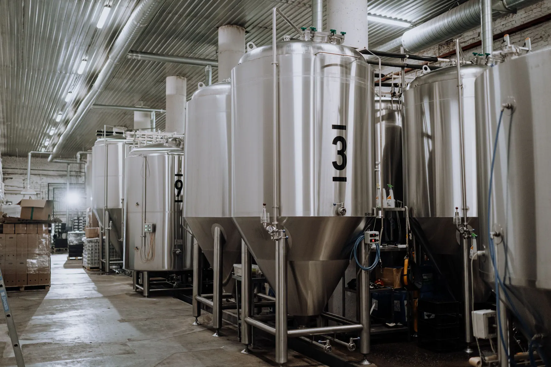 Array of stainless-steel processing vessels and pipework
